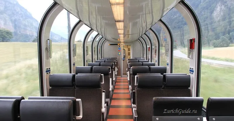 Inside a panoramic carriage with curved roof windows