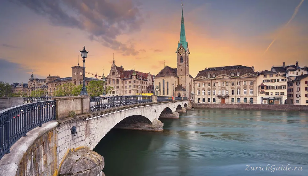 The Fraumunster and the Munsterbrucke over the Limmat in Zurich at sunset